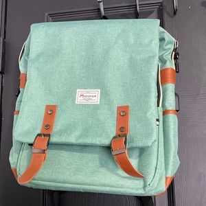 Brand new Modoker backpack, tags still on never used.